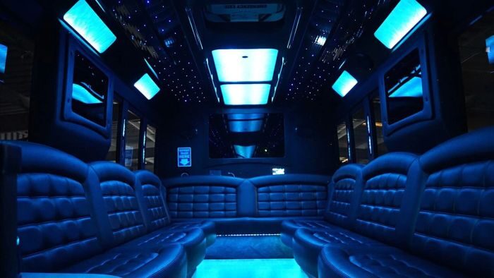 Wraparound seating and blue LED lights – Longmont party bus rental